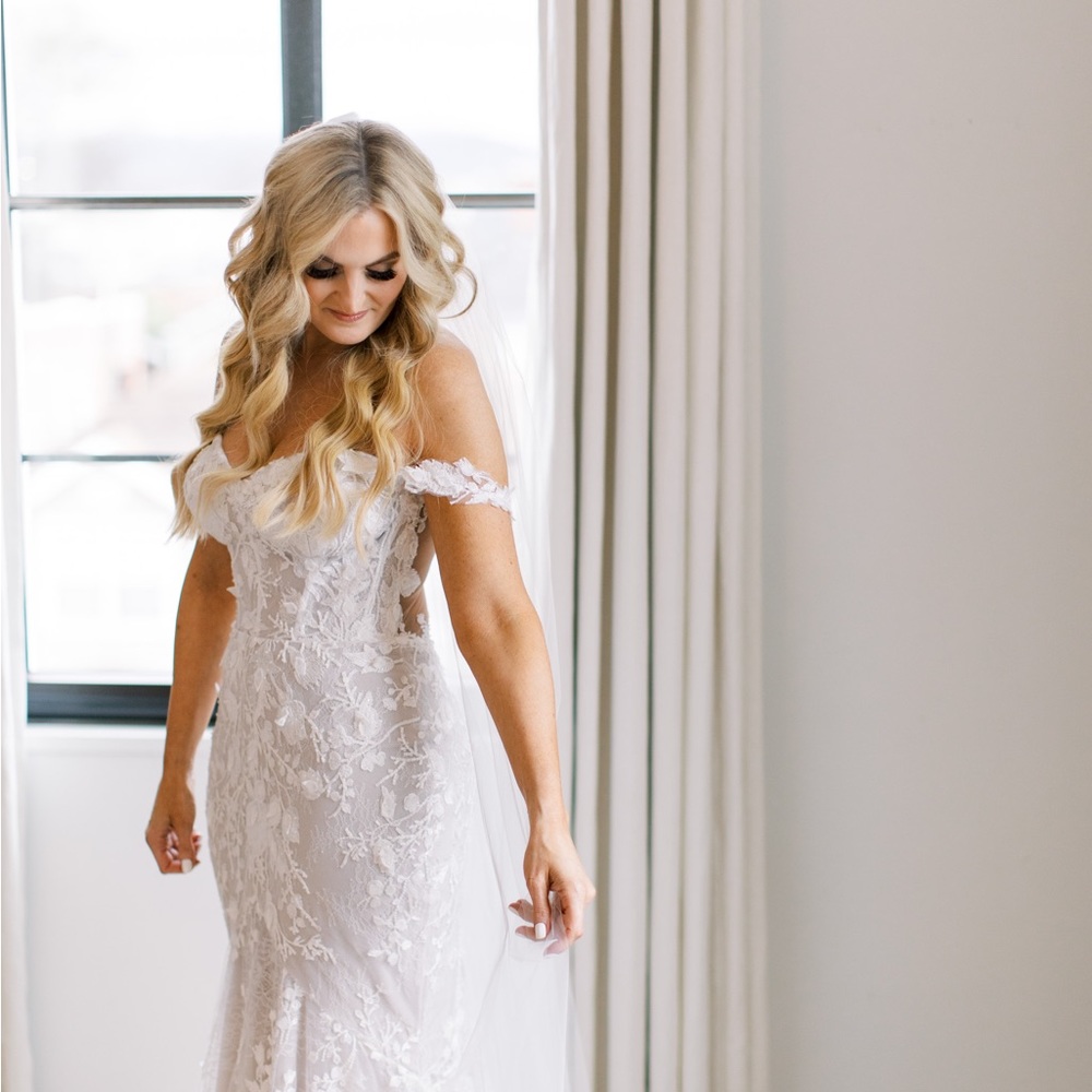 Wedding dress. Purchased in 2023. Custom sized.